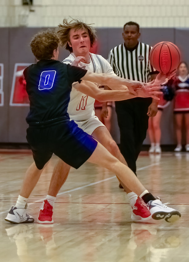 Heritage's Hank Gorzelanski looks for some working room against Highlands Ranch defender Peyton Tereick during a Continental League game Jan. 20 in Littleton.