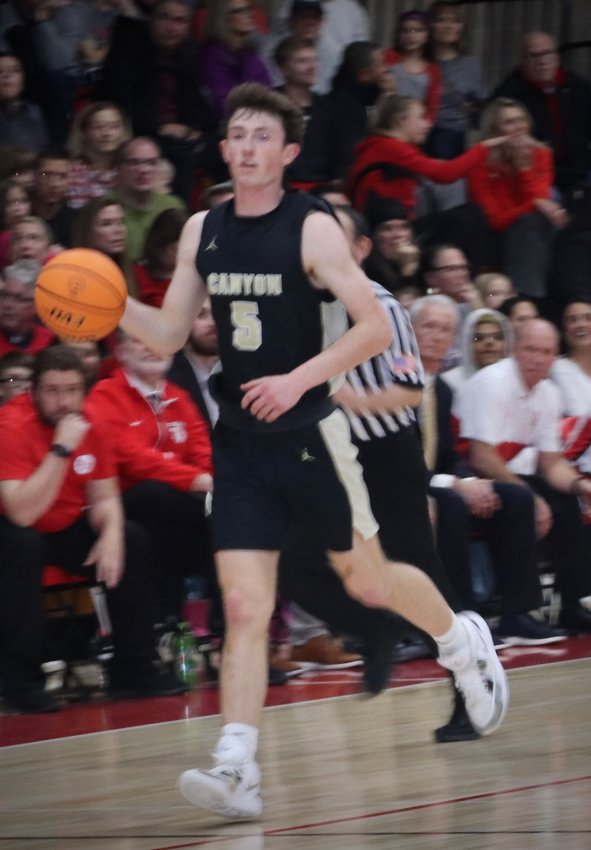 Rock Canyon’s Mac Terry hit a fall-away shot just before the final buzzer to give the Jaguars a 59-57 win over Regis Jesuit on Jan. 20.