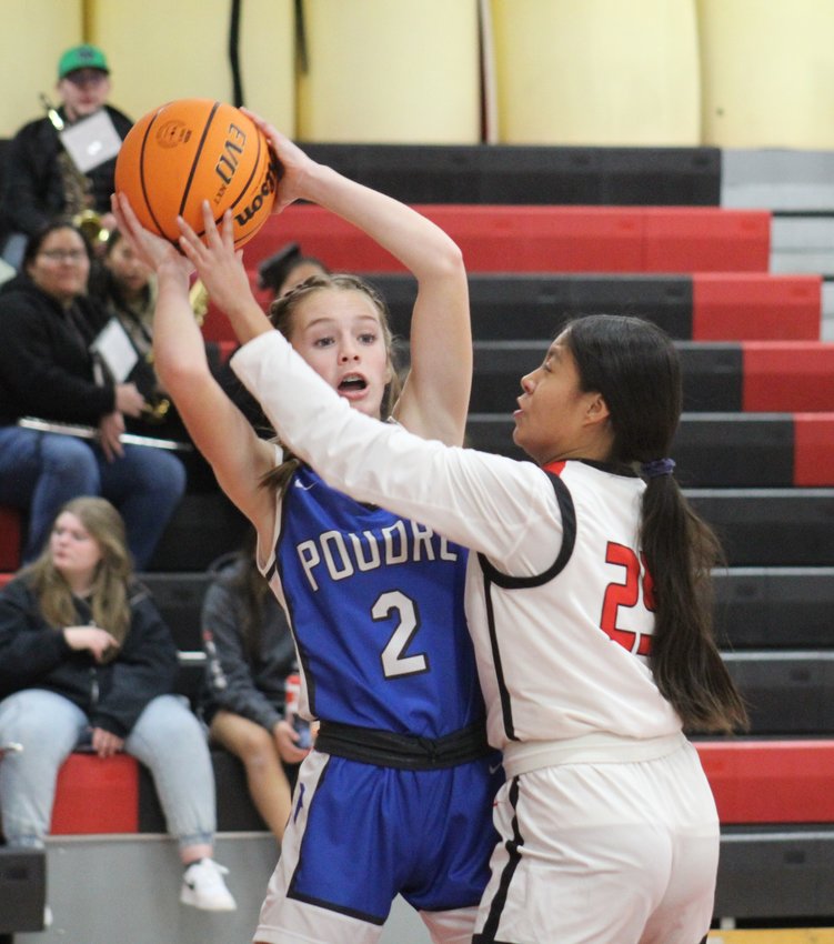Brighton's Lillty Rivas won't let Poudre's Jacqui Wilson move very far -- or very fast -- during the first half of the teams' game Jan. 24 in Brighton.