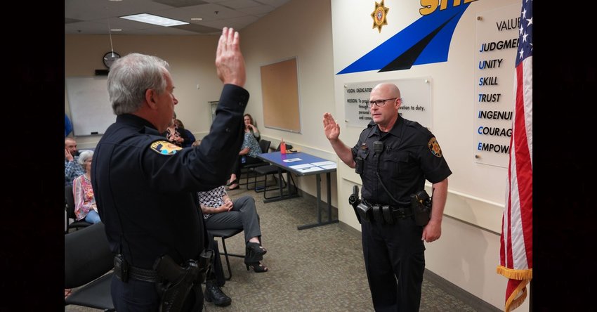 Jeff Engel, right, is sworn in as a Douglas County sheriff's deputy by Undersheriff Dave Walcher in this June 2022 photo from the department's Facebook page. Engel was returning to the Douglas County Sheriff's Office after serving as the police chief in Berlin, Wisconsin. Engel has now been chosen as the interim police chief for Elizabeth.