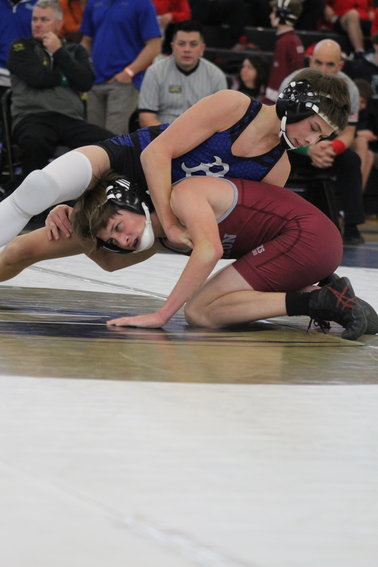 Horizon's Caleb Schultz looks for some room to work as Broomfield's Ethan Brown applies pressure from the top during a first-round, 106-pound match at the Front Range League tournament Jan. 28 at Prairie View High School. Brown won by a major, 8-0 decision.