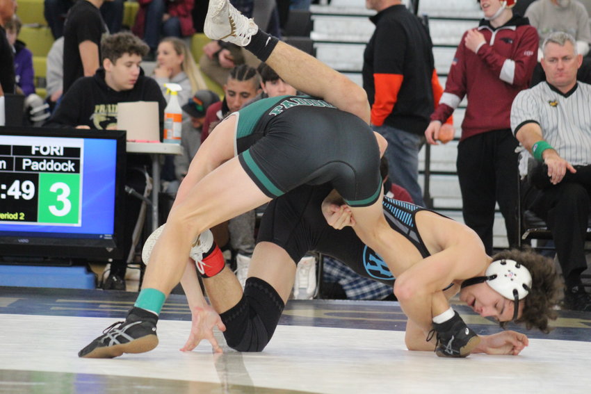 Mountain Range's Zac Cronholm looks for some advantage against Fossil Ridge's Andrew Paddock during a 132-pound match at the Front Range League wrestling tournament Jan. 28 at Prairie View High School. Cronholm won by pinfall in 3:56.
