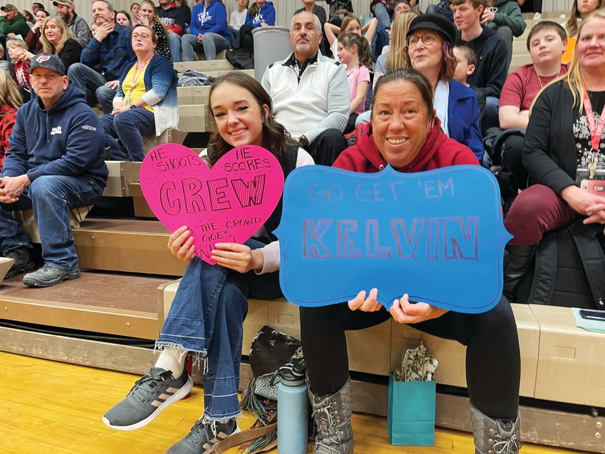 Several members of the crowd held up handmade signs to support the unified team players.