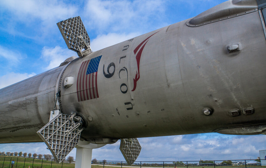 A Falcon 9 sits on display at Space Center Houston.