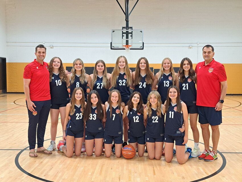 Members of the Macron Select team, from left to right bottom: Grace Schillie, Giada Lampert, Josie Gregersen, Alexi Maes, Aubry Grieve, Reese Dragul. From left to right top: Assistant Coach Kenny Queen, Caley Pfeiffer, Sydni Gregory, Ruby Maliskas, Hazel Hermes, Alexa Rose, Finely Queen, Ella Grkinich, and Head Coach George Grkinich.