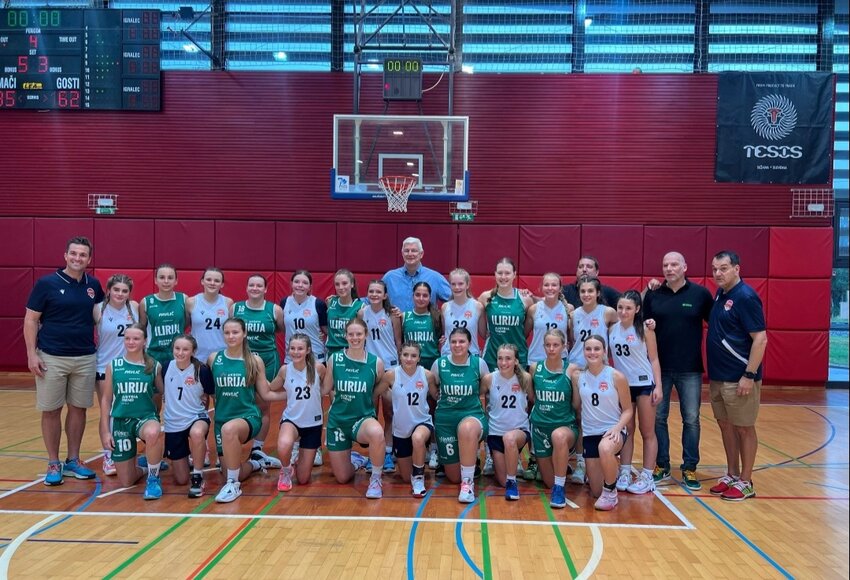 Macron Select poses with Slovenia's 17U national team for a photo after an exhibition game in August. Though Macron lost, the players said the experience polished their skills and will make them better basketball players going forward.