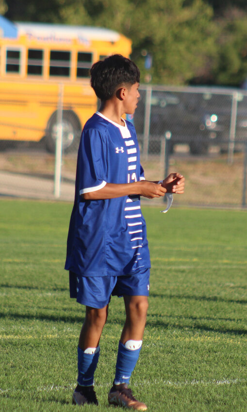 Fort Lupton freshman Archi Gonzalez makes some adjustments during a break in play against Bennett Sept. 7.
