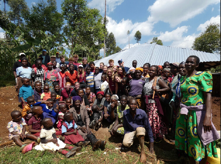HEART, including Eric McNair, pose with community members from the Kiberia slum neighborhood of Nairobi, Kenya.