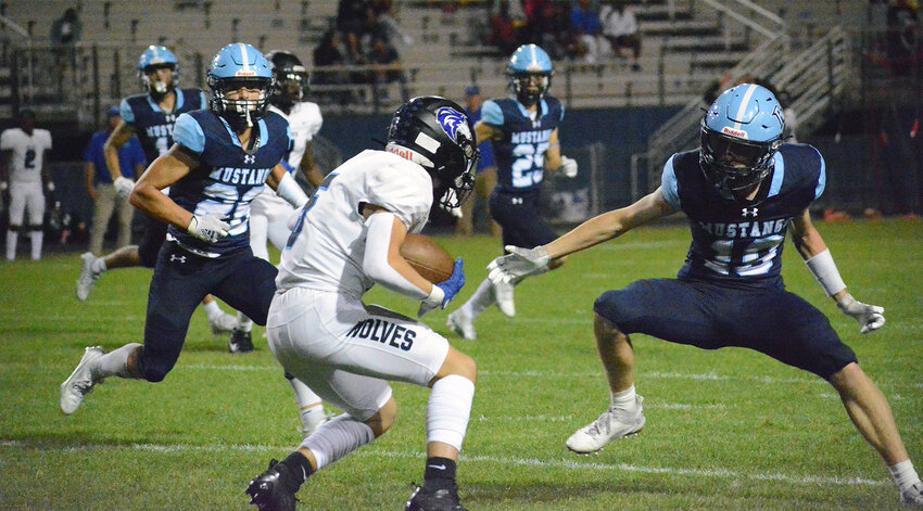 Ralston Valley senior Jacob LaBarbera (19) has a beat on Grandview senior Nate Denton during the first half Friday, Sept. 8, at the North Area Athletic Complex. The Mustangs took a 30-15 victory in Ralston Valley's home opener at the NAAC.