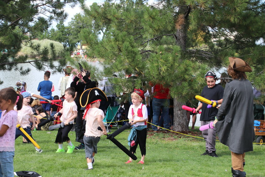 Small pirates engage in sword battles at Northglenn’s 2022 Pirate Fest.