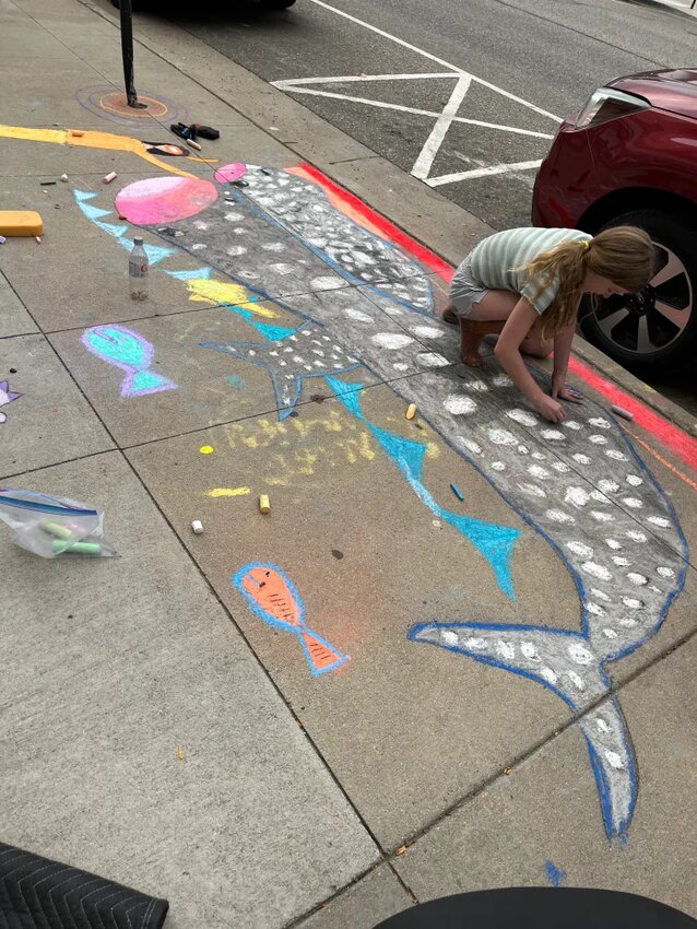 Children at the Walk the Chalk event decorated the sidewalks with their own artwork.