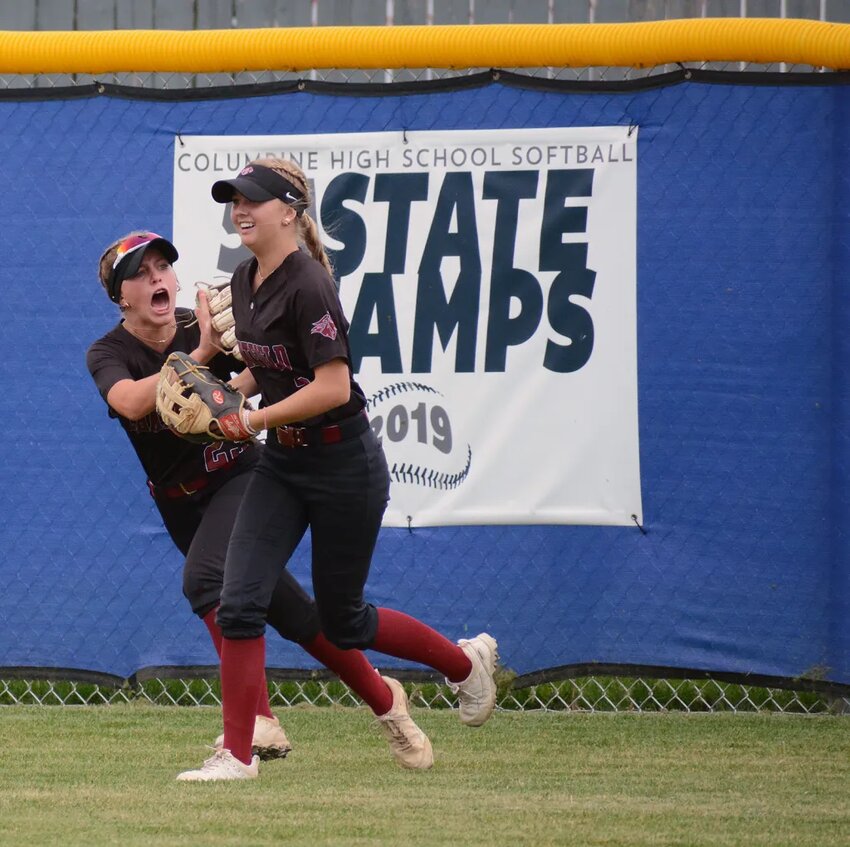Chatfield junior Kendall Davros, left, is fired up after junior Ally Dodge makes a catch at the centerfield wall during the Class 5A Jeffco League game against Columbine on Monday, Sept. 18, at Dave Sanders Memorial Field. Chatfield won 5-3.