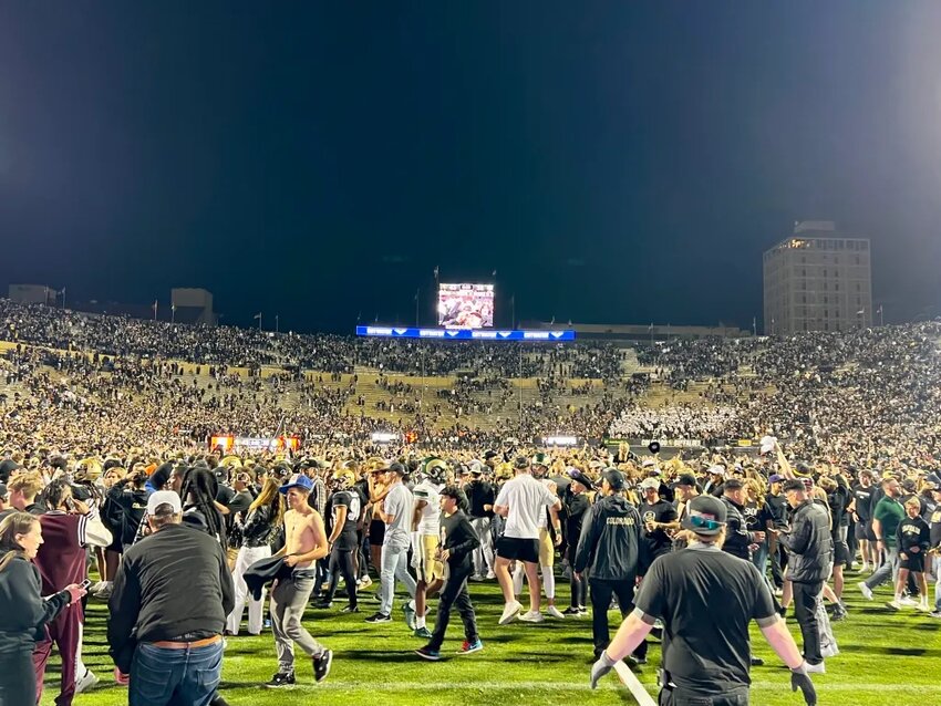 Fans storm the field after Colorado beats Colorado State 45-35 in double overtime Sept. 16 at Folsom Field in Boulder. Fourteen players from Colorado Community Media's various coverage areas suited up for the rivalry game.