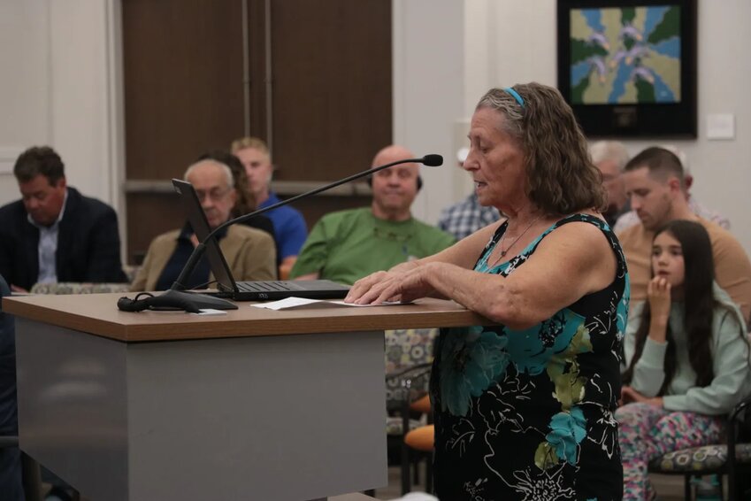 Mary Hansen, a resident of Geneva Village, asks the city council to save her home at the Sept. 19 city council meeting.