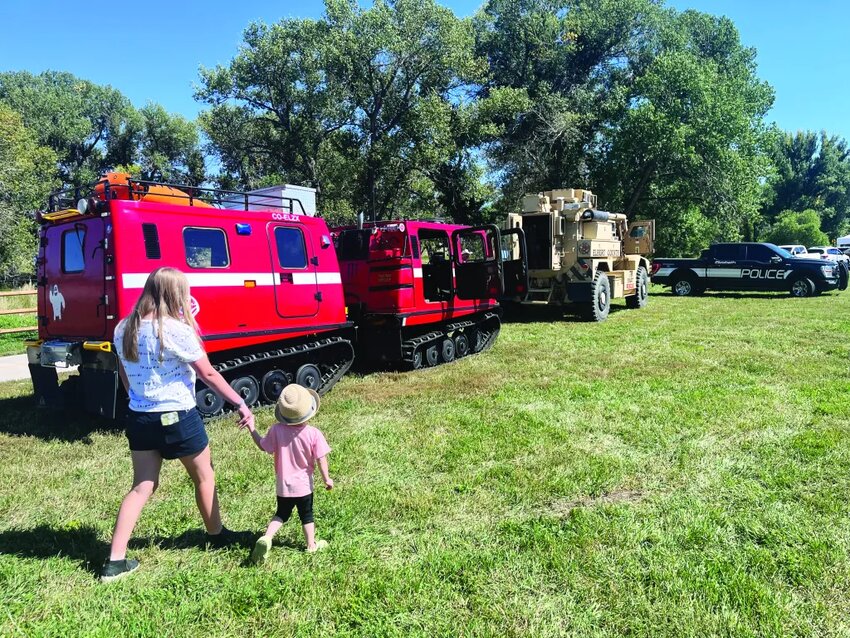Elizabeth residents take a look at fire department vehicles on Sept. 9 in Running Creek Park.