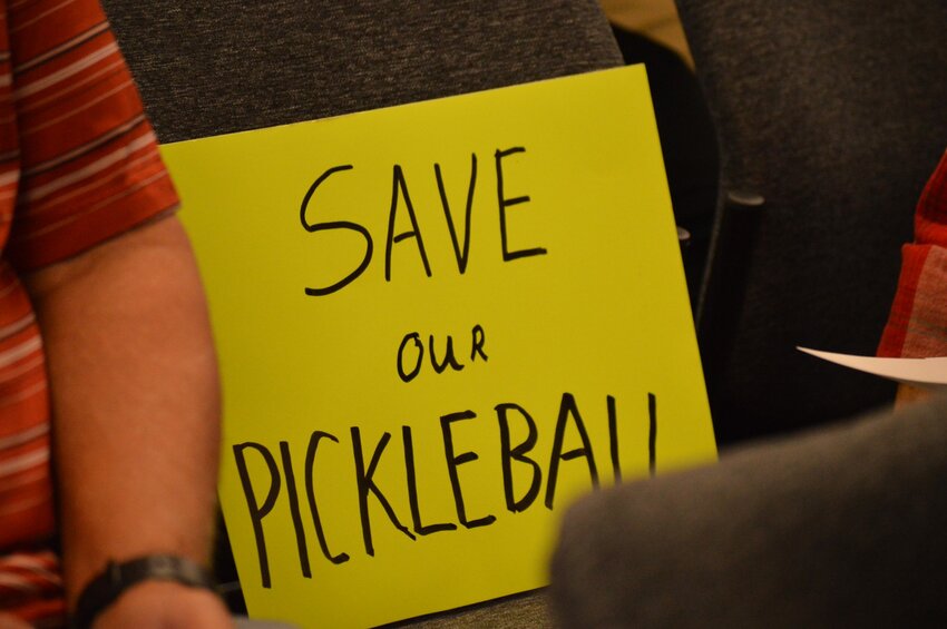 A resident brought a sign that said, “Save our pickleball,” to the Sept. 19, 2023, Centennial City Council meeting.