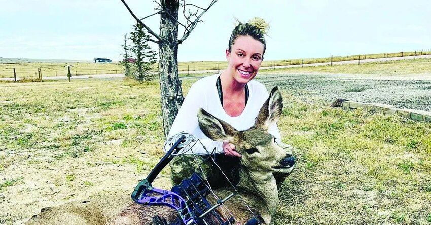 Elbert County resident Calla Walker poses with a mule deer she harvested and a compound bow. “This is my third hunting season,” Walker told the Elbert County News. “I hunt turkey, dove, antelope and mule deer.”